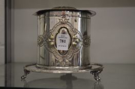 A plated biscuit box with hinged cover.