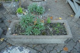 A pair of reconstituted stone rectangular shaped planters.