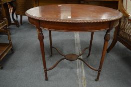 A mahogany oval shaped centre table.