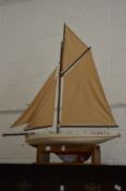 Moya, a painted pond yacht with lead keel.