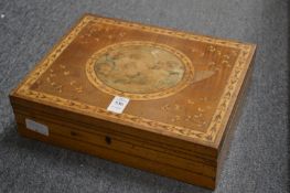 A good Regency inlaid satinwood sewing box, the hinged cover decorated with a scene of playful