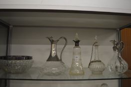 Silver mounted etched glass decanter and other items.
