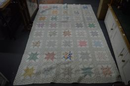 A good patchwork quilt, possibly American.