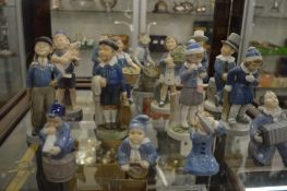 Collection of Royal Copenhagen figures of children.