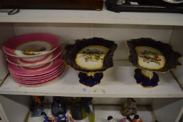 A porcelain part dessert service, the centres painted with landscapes together with a pair of