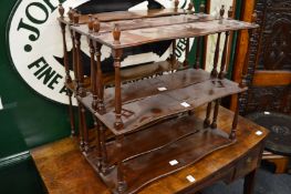 Three mahogany wall shelves.