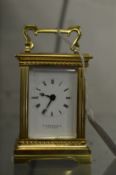 A good small brass carriage clock, retailed by Garrard, London.