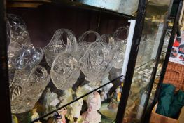 A large quantity of cut glass flower baskets, vases etc.