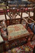A Georgian design mahogany dining chair with arms.