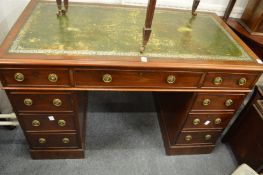 A mahogany twin pedestal desk.