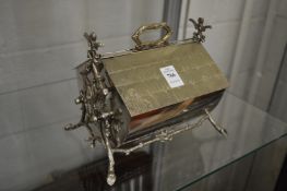 A Wilsons patent biscuit box of naturalistic form.