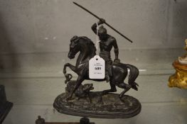 A 19th century spelter model of an Indian brave on horseback being attacked by a tiger.