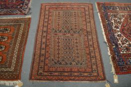 A small Persian rug, blue ground with stylised decoration, 131cm x 89cm.