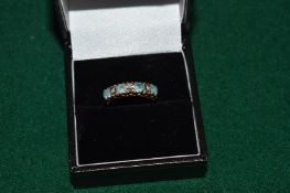 A 9ct gold and gem set ring.