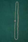 A good graduated pearl necklace, the clasp set with three diamonds.