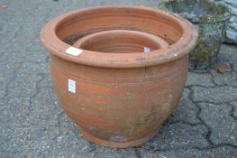 Two terracotta plant pots.