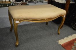A gilt wood and upholstered stool.