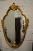 A pair of gilt wood shield shaped wall mirrors.