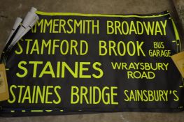 A group of bus destination posters.