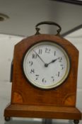 A small mahogany cased mantel clock.