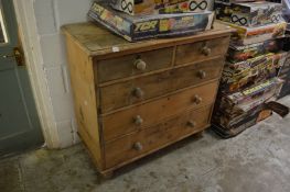A pine chest of drawers.