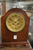 A mahogany cased dome topped mantel clock.