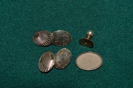 A pair of 9ct gold cufflinks, a single cufflink and a 9ct gold and pearl stud.