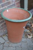 Large terracotta plant pot.