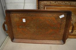 An Eastern brass inlaid twin handled tray together with a bone inlaid tray.