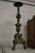 A pair of cast metal pricket candlesticks.
