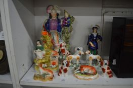 A group of Staffordshire figures and animals.