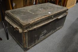 An old brass studded leather covered trunk.