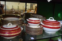Quantity of George Jones red and gilt decorated dinnerware.