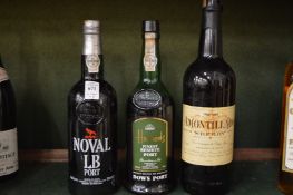 Two bottles of port and a bottle of sherry.