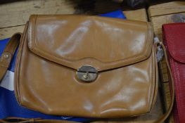 A Ladies brown leather handbag.