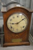 An Edwardian mahogany mantel clock.