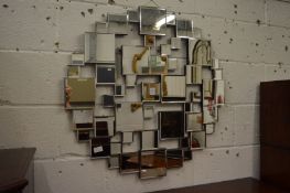 Decorative multi panel wall mirror.