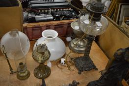 Decorative oil lamp converted to electricity and other lamps.