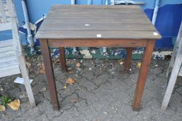 A wooden garden table.