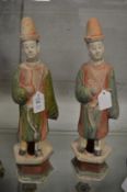 A pair of Chinese painted pottery tomb figures.