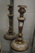 A pair of old Sheffield plate candlesticks, worn.