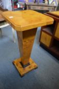 A pair of Art Deco style blonde wood pedestal stands.