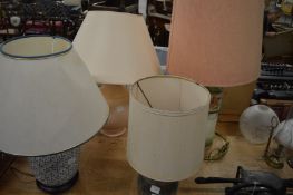 Four pottery table lamps.