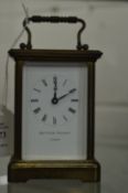 A brass carriage clock, retailed by Matthew Norman, London.