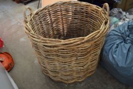 A large wicker log basket.