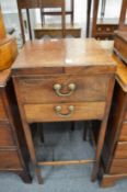 A mahogany washstand with bi-fold top.