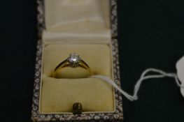 An 18ct yellow gold and diamond solitaire ring.