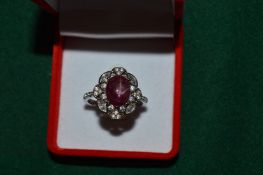 A silver ring set with a 4.5ct natural ruby with certificate.
