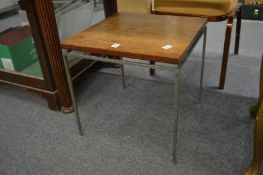 A modern rosewood and chrome small coffee table.