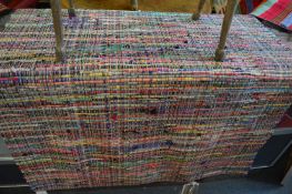 A John Lewis mulit-coloured flat weave rug, 180cm x 120cm.